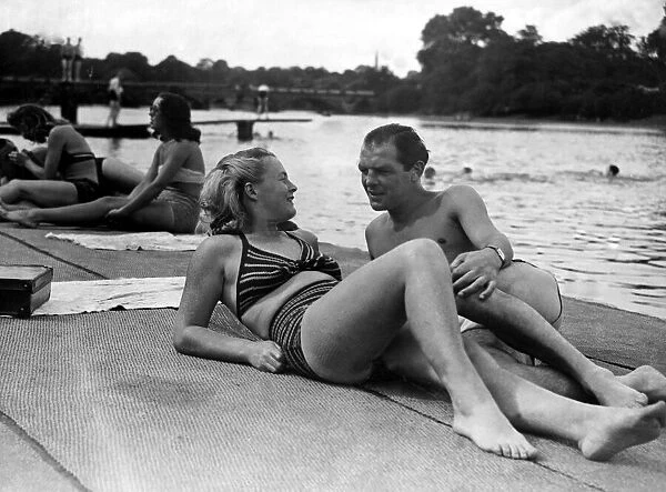 Jack The Kid Berg and his wife sun bathing in Hyde Park by the Serpentine