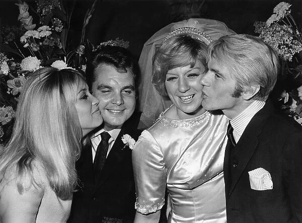 Jackie Irving kisses Tony Hatch while Adam Faith kisses Jackie Trent after the wedding
