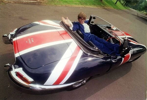 John Dingwall dressed as Austin Powers in E Type Jaguar car September 1999 Union Jack
