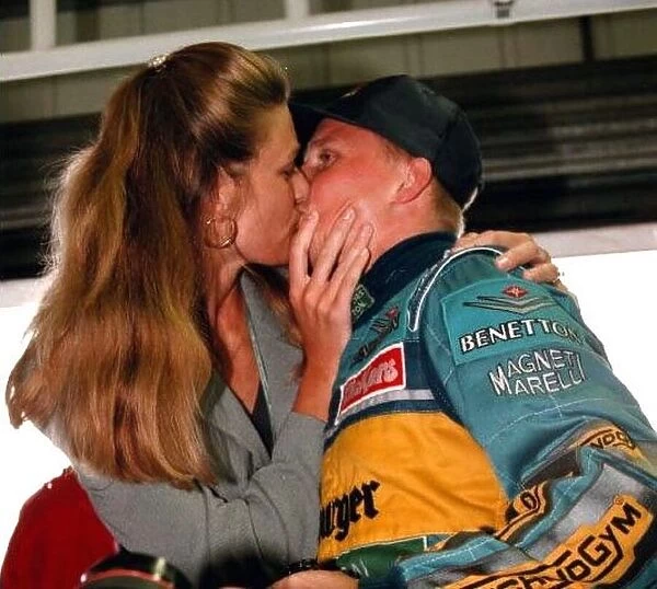 Johnny Herbert kissies his wife Rebecca after winning the british Grand Prix 1995 at