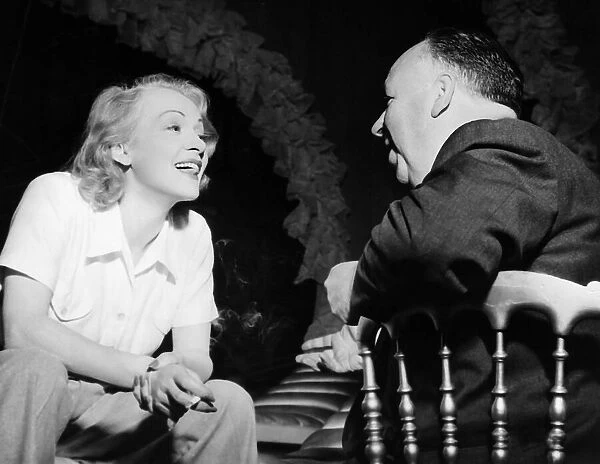Marlene Deitrich talks to Alfred Hitchcock film director 1949