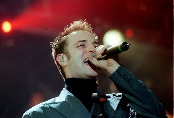 Mikey Graham of pop group Boyzone December 1999 singer singing performing at the SSEC in