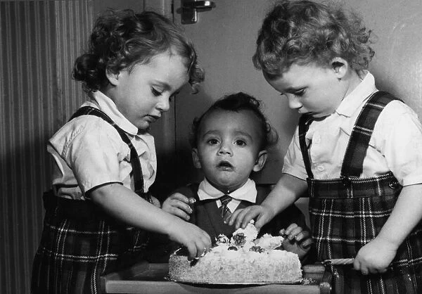 Mum bought them a birthday cake - and the two year old Leese triplets got to grips with