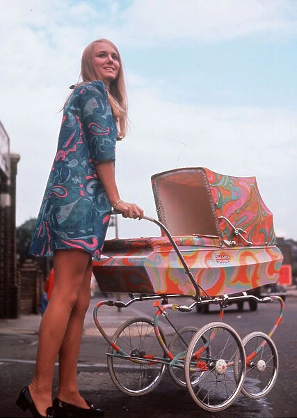 Nicky Hunt in mini dress with psychedelic pram, 1967