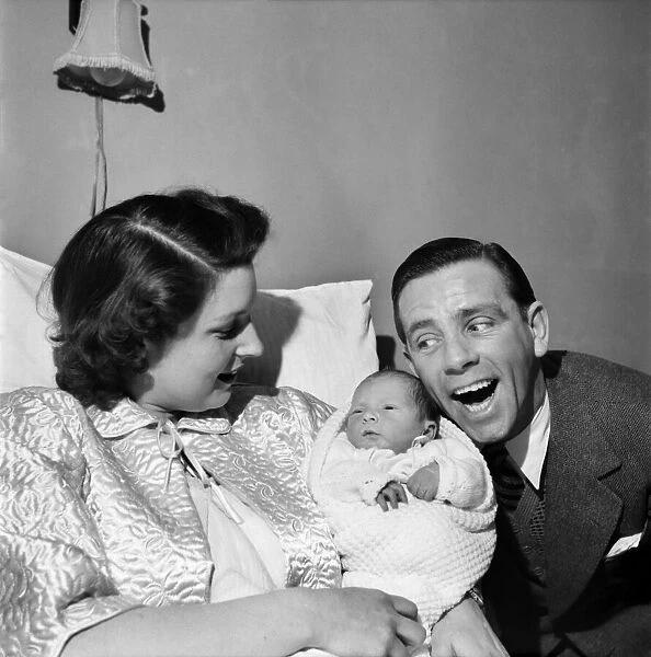 Norman Wisdom with baby son Nicholas. March 1953 D1491