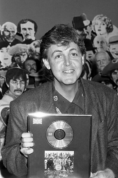 Paul McCartney receiving an award for Sgt. Peppers Lonely Hearts Club Band Album