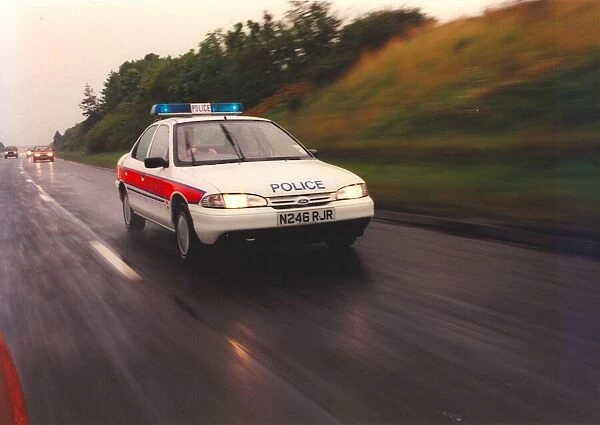A police officer drives a new rapid response patrol car