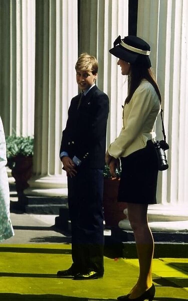 Prince William standing next to a young lady