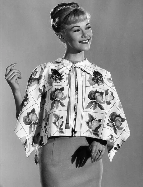 Reveille fashions 1961: Jo Waring wearing a floral print blouse. December 1961 P008817