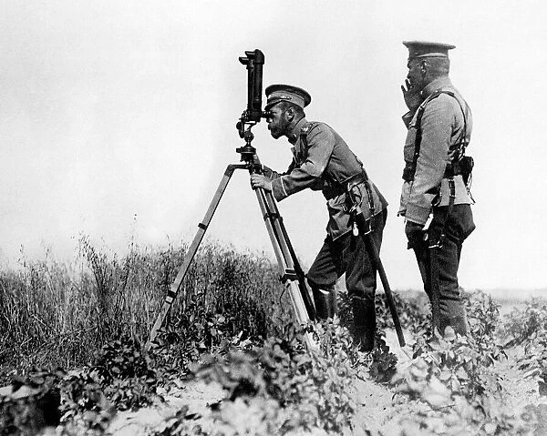 Russian leader Tsar Nicholas II looking through a periscope at the enemy position