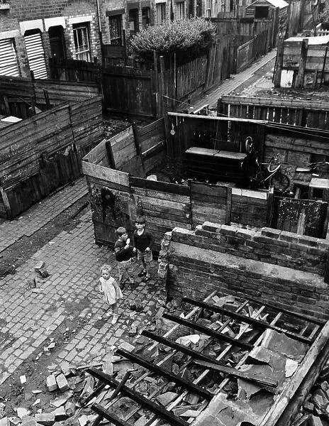 Slum housing in Birmingham. June 1967 Children play amongst the wreckage