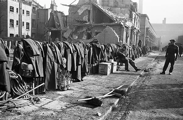 Soldiers discarded tunics and coats as they help with the clean up of Chelsea following