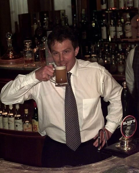 Tony Blair about to drink Blairs Brew Special beer, April 1997