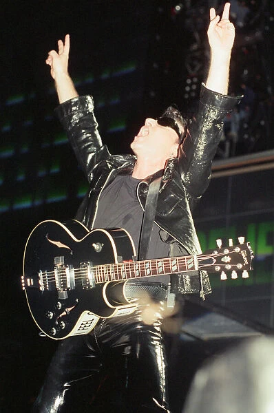 U2 in concert on the Zoo TV Tour, Wembley Stadium. Bono performing on stage