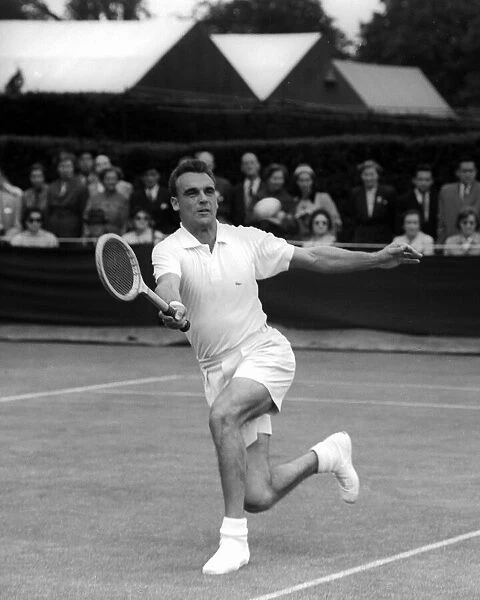 Vic Seixas in action against V. J Clayton on the first day of the 1955 Wimbledon Tennis