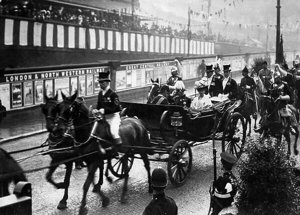 A visit to Manchester by King George V and Queen Mary, riding in state carriage with