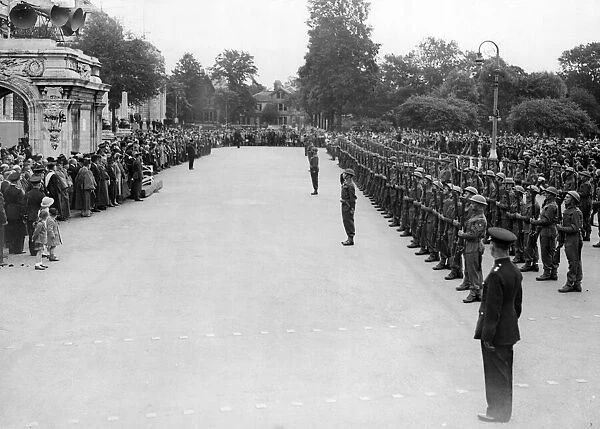 The Welch Regiment presents arms and salutes the city of Cardiff. Circa 1940