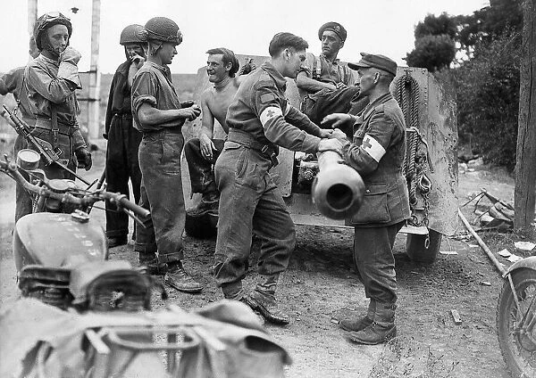 World War 2 August 1944 British and German Red Cross personnel meet over a howitzer