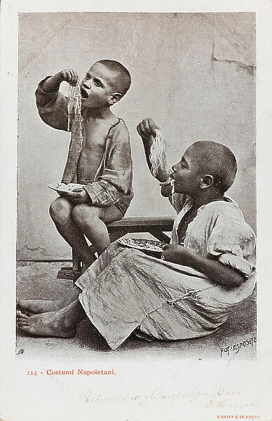 Costumes of Naples. Portrait of two children eating a plate of spaghetti with their hands, postcard