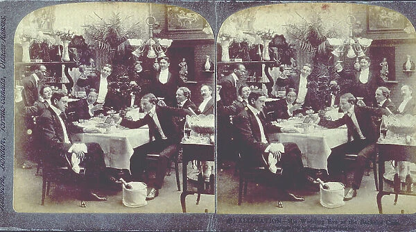 A group of bachelors in evening dress, around a laid table, they are making a toast, directed towards the man sitting at the head of the table in the foreground