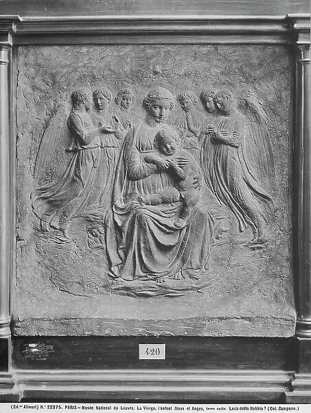 Madonna with Child and six angels, work by Luca della Robbia, preserved in the Louvre Museum, Paris