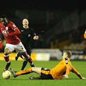 Avoiding a Tackle: Kodjia Eves Dangerously Past Saville in Wolves vs. Bristol City Clash