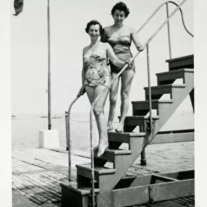 1950s Bathing Lovelies posing on a set of steps