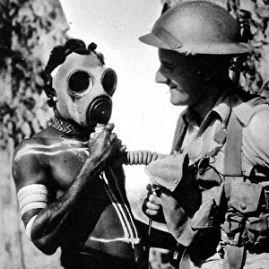Aborigine trying on a Gas Mask, Australia, Second World War