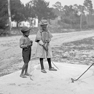 African-American children playing golf in America