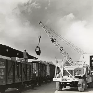 Airmen Loading Railcars Using a Crane on a Truck During ?