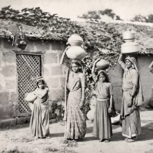 Bheel of Bhil women carrying water Kathiawar, India