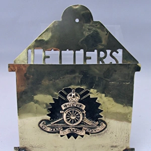 Brass letter rack with badge of the Royal Artillery