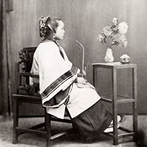 c. 1880s China - Chinese woman in a studio setting