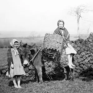 Carrying turf, Co Mayo, West of Ireland, early 1900s