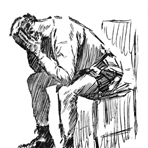 Despairing man with his head in his hands