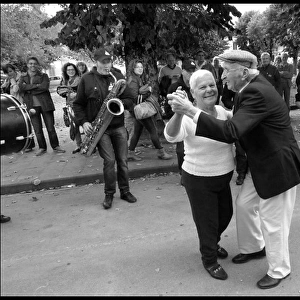 Elderly couple dancing at italian festa
