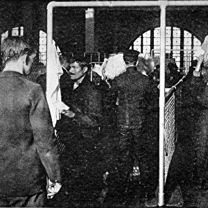 Examining Immigrants at Ellis Island, New York, 1911