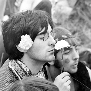 Hippy man with flowers at Woburn Park