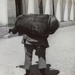 Man carrying a heavy weight