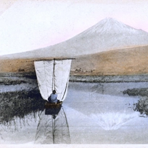 Mount Fuji, Japan - A small sailing boat crosses wetlands