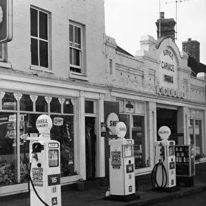 Petrol pumps on the pavement at a service station at Ellesmere, Shropshire, England