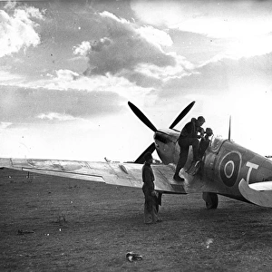 A pilot is about to climb into his Supermarine Spitfire IX