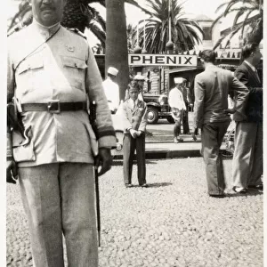 Policeman and Hotel staff Madeira, Portugal Date: circa 1930s