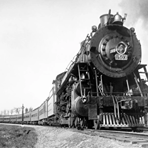 A steam engine on the American railway rounding a curve