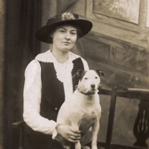 Studio portrait, woman with bull terrier