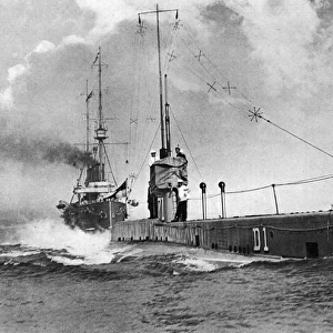 Submarine D 1 with HMS Drake in her wake