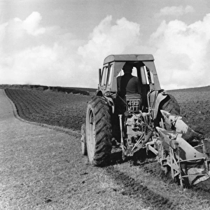 Tractor Pulling a Plough