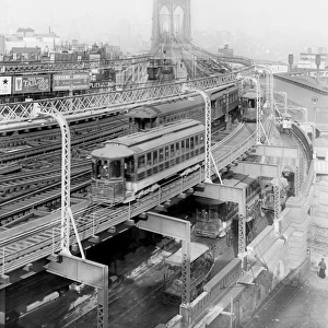 Train on the elevated railway approach to Brooklyn Bridge, B