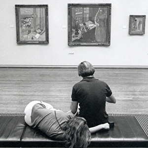 Visitors resting in The Tate Gallery, London