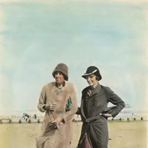 Two women on the beach at Bognor Regis. Date: 1920s